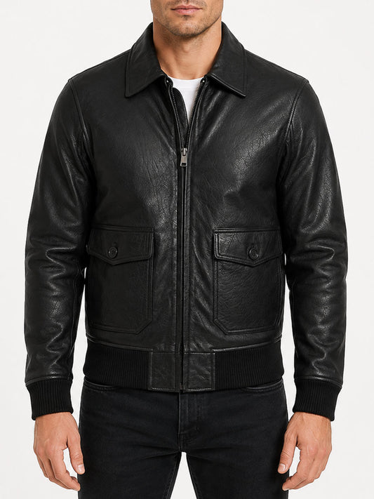 Men's black lambskin leather bomber jacket with shirt-style collar, zipper closure, and ribbed cuffs on display