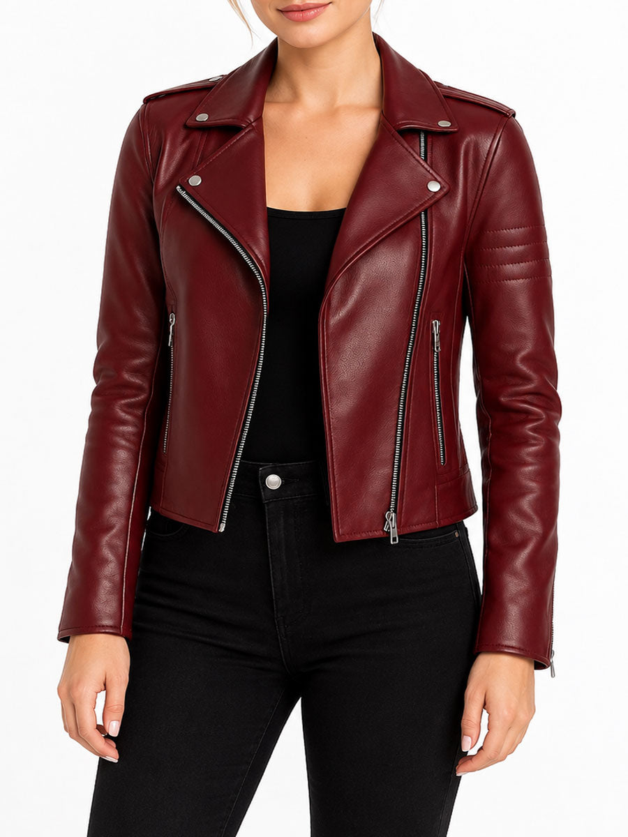 Burgundy leather biker jacket front view on female model featuring asymmetrical zipper, notch lapel collar, and quilted sleeve detailing.